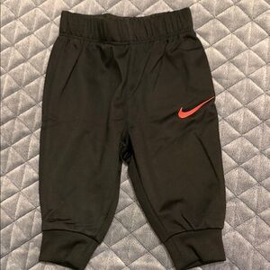 Nike Kids Black Joggers with Red Swoosh